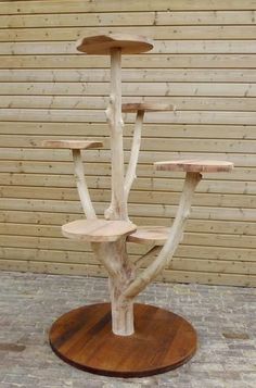 a wooden stand with three trees on it