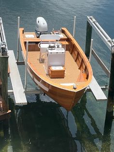 a small boat tied to a dock in the water