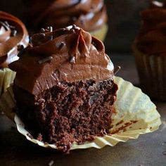 chocolate cupcakes with frosting and sprinkles on top