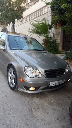 a mercedes benz is parked on the street