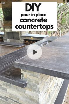 an outdoor kitchen with stone counter tops and grilling area in the background, text overlay reads diy pour in place concrete countertops