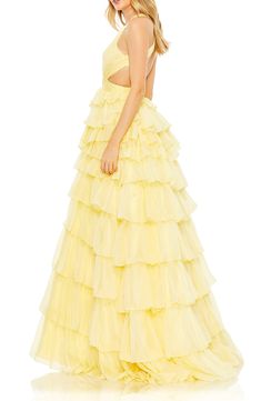 Tiers of flowy ruffles and a dramatic open back with crisscrossing straps elevate this occasion-ready gown to a scene-stealing status. 62 1/2" length Plunge neck Sleeveless Lined 100% polyester Spot clean Imported Bold Prom Dresses, Prom Ball Gown, Prom Dresses Sleeveless, Chiffon Evening Dresses, Chiffon Fashion, Pleated Bodice, Mac Duggal, Necklines For Dresses, Dress Cover