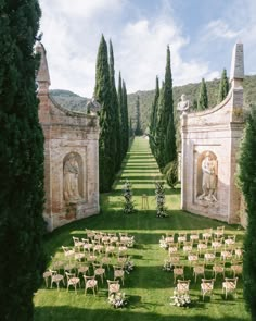 an outdoor ceremony setup with chairs and tables