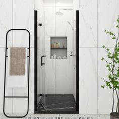 a bathroom with white walls and black trimmings on the shower door is shown