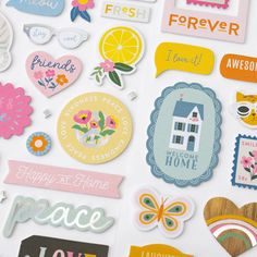 a bunch of stickers that are on top of a white surface with the words happy as home