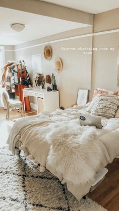 a bedroom with a bed, rugs and other items on the floor in front of it