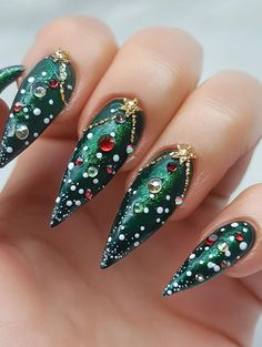 Embrace the holiday spirit with 29 enchanting Christmas tree nail art ideas. From classic pine silhouettes to modern, abstract interpretations, these festive designs transform your manicure into a winter wonderland. Experiment with metallic accents for ornaments, use dotting tools to create strings of lights, or paint miniature wrapped gifts at the base of each tree. Your nails will become a joyful celebration of the season. Christmas Nails Abstract, Abstract Christmas Nails, Christmas Tree Nail Designs, Christmas Tree Nail Art, Christmas Tree Designs, Tree Nail Art, Negative Space Nail Art, Festive Manicure, Christmas Tree Nails