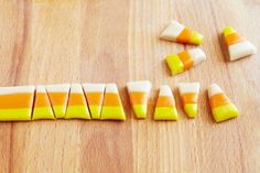 candy corn on a cutting board with pieces cut out