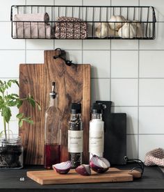 a cutting board with spices and bottles on it