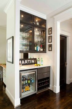 an image of a home bar with wine glasses on it