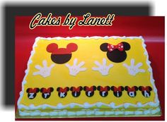 a yellow cake with mickey mouse ears on it's face and the words cakes by lenot