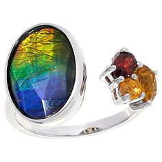 Discover the radiant allure of the Canadian wilderness with this exquisite Sterling Silver Oval Ammolite and Multigem Ring by Kenneth Bradley. A masterpiece of vibrant colors and intricate design, this ring showcases the rare and captivating Ammolite, a gemstone found only in Alberta, Canada.

- Material: Sterling Silver with Rhodium Plating
- Gemstones: Ammolite/Quartz Triplet, Yellow Citrine, Orange Opal, Red Garnet
- Dimensions: Approx. 13/16"L x 7/8"W x 15/16"H; Shank 1/8"W
- Size: 9
- Color Fine Jewelry Multicolor Cabochon Gemstones, Multicolor Cabochon Gemstones Fine Jewelry, Multicolor Cabochon Gemstones For Fine Jewelry, Multicolor Cabochon Rings In Fine Jewelry Style, Multicolor Cabochon Rings Fine Jewelry, Luxury Multicolor Cabochon Rings, Multicolor Polished Finish Ring Jewelry, Luxury Multicolor Sterling Silver Rings, Multicolor Polished Ring Jewelry