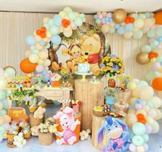 winnie the pooh birthday party with balloons and decorations