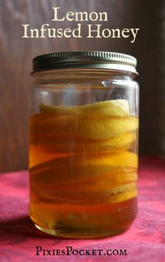 a mason jar filled with lemon infused honey