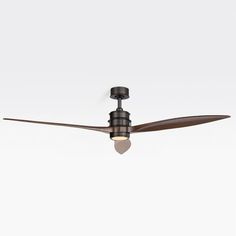 a ceiling fan that is on top of a white wall and has a light in it