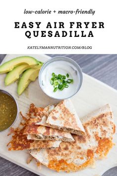 quesadilla on a cutting board with salsa and avocado