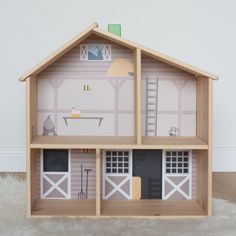 a doll house made out of wood and paper