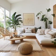 a living room filled with lots of furniture and plants