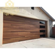 a wooden garage door in front of a house