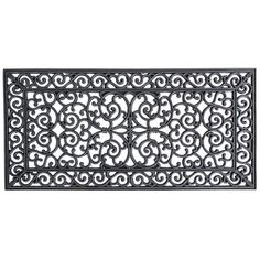 an iron door mat with scroll designs on the front and back sides, in black