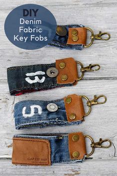 two denim key fobs with the words denim fabric on them and one has a mustache