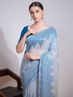 Precise splendor comes out of your dressing trend with this light blue heavy georgette trendy saree. The ethnic sequins embroidered work on the attire adds a sign of beauty statement to your look. The ravishing light blue party wear saree comes with a similar color blouse made of mono banglori material. This light blue sequence georgette saree comes with a 5.50-meter long and stitched 1.00-meter blouse material. Rich look attire to give you the right choice for any party or function. Get our hig Blue Georgette Pre-draped Saree With Self Design, Blue Pre-draped Saree With Mirror Work, Bollywood Style Blue Pre-draped Saree For Eid, Blue Zari Work Party Wear Pre-draped Saree, Traditional Blue Pre-draped Saree With Mirror Work, Festive Blue Georgette Pre-draped Saree, Festive Blue Pre-draped Saree With Mirror Work, Bollywood Blue Pre-draped Saree With Mirror Work, Blue Sequined Pre-draped Saree For Party