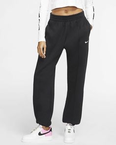 Nike Women's Sportswear Essential Fleece Trouser Pants Style#: BV4089-010 Black Size: X-Large (XS=0-2, S=4-6, M=8-10, L=12-14, XL=16-18 (16W), XXL=20-22 (18W)). LOOSE WITH A DOSE OF STYLE. Kick back in the Nike Sportswear Essential Fleece Trousers. Made from dense, brushed-back fleece in a loose fit, they give you warm coverage with chic pin tucks down the front. Dense, brushed-back fleece in a loose fit drapes you in soft comfort with room to move. An elastic waistband lets you adjust the fit, Fleece Pants Women, Sweatpants Women, Nike Sportswear Women, Sportswear Trends, Nike Sweats, Nike Sweatpants, Black Sweatpants, Women Essentials, Fleece Pants