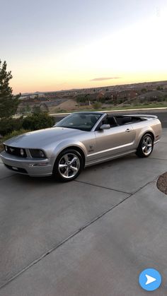 a silver car parked on top of a parking lot