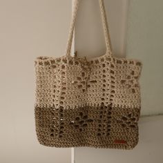 a crocheted bag hanging from a hook