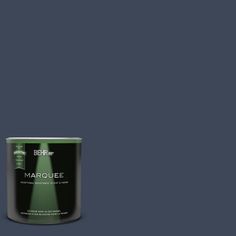 a can of marquee paint on a dark green background