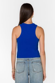 The Weston Ribbed Tank Top offers a fitted look with a soft and stretchy feel. Made from cotton and elastane, it provides comfort and a flattering shape. The vibrant Dazzling Blue color adds a pop of brightness, making it perfect for layering or wearing on its own. Material: 95% Cotton and 5% Elastane Machine Wash Cold Color: Dazzling Blue Model is 5'9" and wearing a size S Imported Trendy Blue Top With Ribbed Neckline, Trendy Blue Tops With Ribbed Neckline, Blue Tank Top For Spring, Blue Ribbed Scoop Neck Top, Trendy Blue Tank Top, Casual Tank Top With Ribbed Neckline, Blue Ribbed Tank Top For Summer, Basic Blue Tank Top, Blue Sporty Tank Crop Top