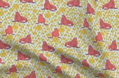 a yellow and red fabric with small dogs on it