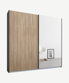 an open sliding door in front of a white wall with a wooden paneled surface