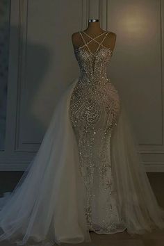 a wedding dress on display in a room