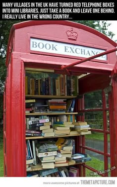 a red phone booth with books in it