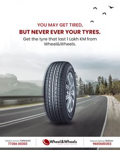 a car tire on the road with birds flying over it and an advertisement for wheel & wheels