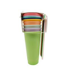 a stack of multicolored cups with spoons and forks sticking out of them