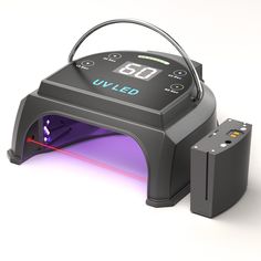 an electronic device is shown with purple light coming out of it's back end