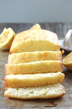 slices of lemon bread sitting on top of a cutting board