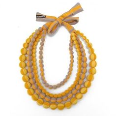 MARIMEKKO Statement Necklace, Fabric Bead Necklace in fabric bag, Finnish design 48 cm 19 in. Gorgeous fabric bead statement necklace by Finnish designer brand Marimekko. Striped cotton jersey fabric in orange, red, yellow and gray.  Length of the necklace is 90 cm ( 35.5"), Diameter of each bead is approx. 2 cm (1¾ inches) Good vintage condition. Marimekko Jewelry - Marimekko Design Whether topping off your Marimekko ensemble, or adding a pop of Finnish charm to an otherwise Marimekko-less outf Necklace Orange, Folk Design, Beaded Statement Necklace, Orange Fabric, Fabric Beads, Gorgeous Fabrics, Fabric Bag, Yellow Orange, Modern Vintage