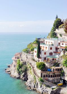 an aerial view of houses on the edge of a cliff