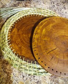 two wooden plates sitting on top of a counter