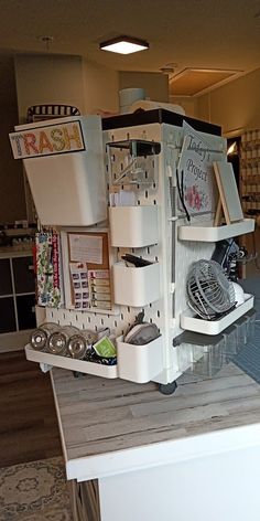 a kitchen counter with an assortment of items on it, including a dishwasher