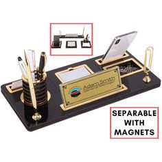 a desk set with magnets, pens and an open laptop computer on it's stand