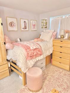 a bed room with a neatly made bed and dresser