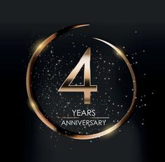 the four years anniversary logo on a black background with gold circles and sparkles around it