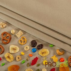 an assortment of candies and pretzels on a table