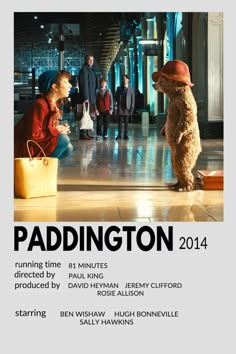 a movie poster for paddington starring in the film's title, featuring two people and a dog