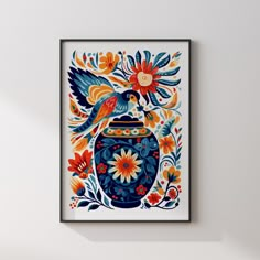 a painting hanging on the wall above a vase filled with flowers and two birds sitting on top of it