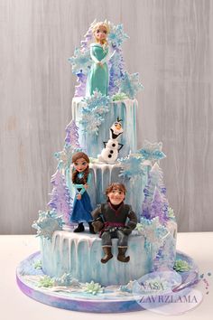 a frozen princess cake with two figures on top